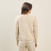 Beige Bow Dog Sweater with a relaxed fit and ribbed hem, perfect for cozy layers in Long Island boutique fashion.