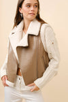 Faux leather moto jacket vest in taupe with shearling trim, offering a stylish, edgy look perfect for the Long Island boutique fashion scene.