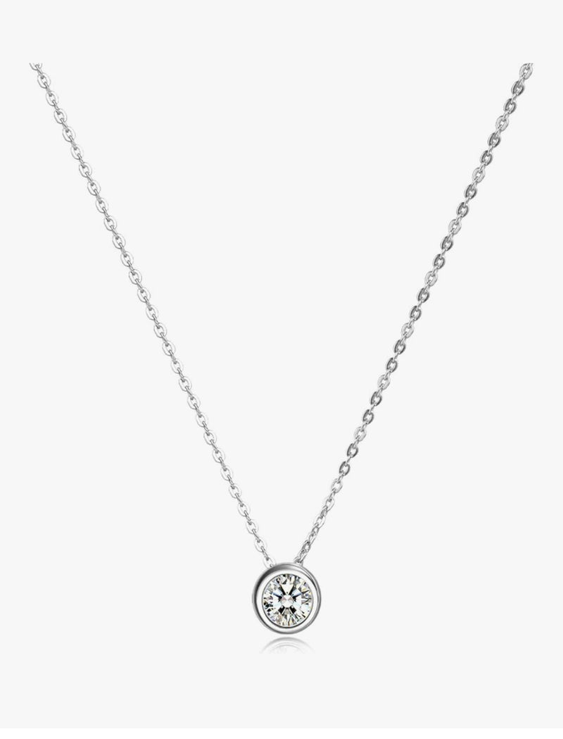 Silver necklace with a round pendant on a white background