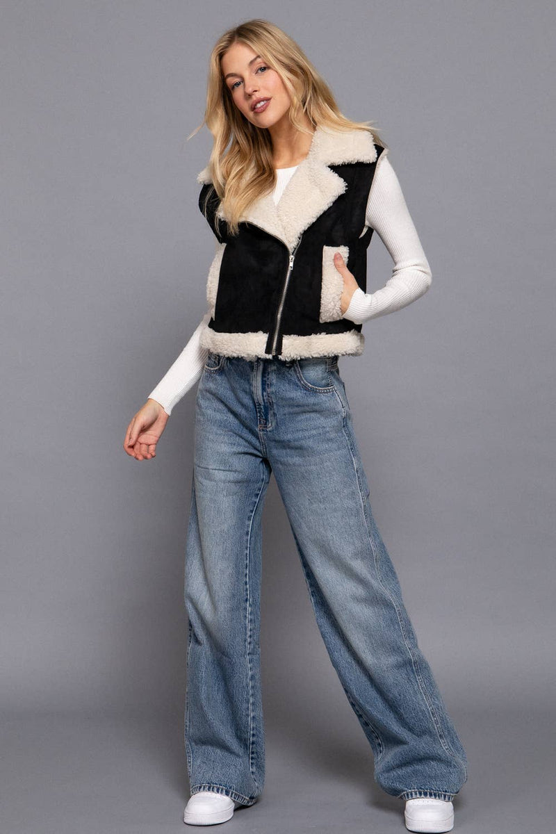 Black faux suede vest with cozy inner fur, stylish zip-up design, perfect for layering in Long Island boutique fashion.