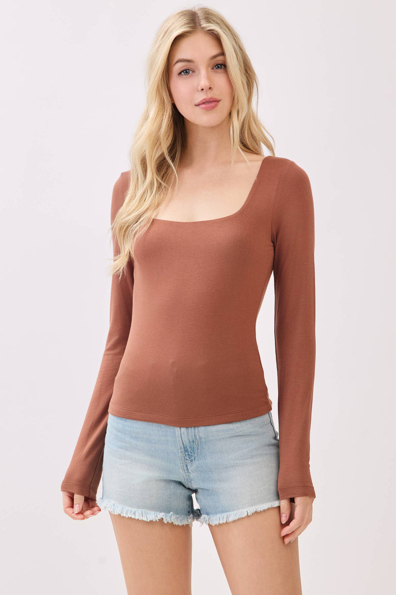 Long sleeve, double layer square neck top in a rich rust color, perfect for stylish layering in Long Island boutique fashion.