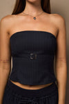 Strapless navy bandeau top featuring a stylish belt detail at the front, paired with a matching mini skort for a chic Long Island boutique fashion look.