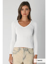 White deep V neck long sleeve top featuring a fitted ribbed design, perfect for layering in Long Island boutique fashion.