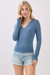 Fitted long sleeve top in soft blue with a stylish V-neck and double-layer design, perfect for Long Island boutique fashion.