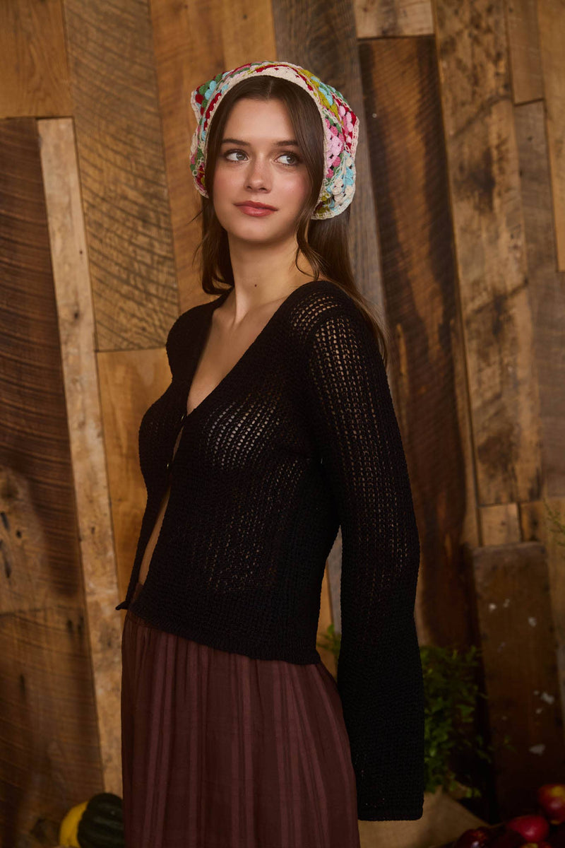 Lightweight black crochet knit cardigan with bell sleeves and a front button closure, perfect for layering in Long Island boutique fashion.