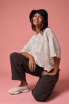 Loose fit, camo ribbed shirt in soft beige with short sleeves, perfect for casual Long Island boutique fashion styles.