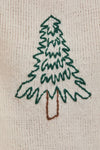 Cozy oversized sweater featuring a green embroidered Christmas tree on a soft beige background, ideal for Long Island boutique fashion enthusiasts.