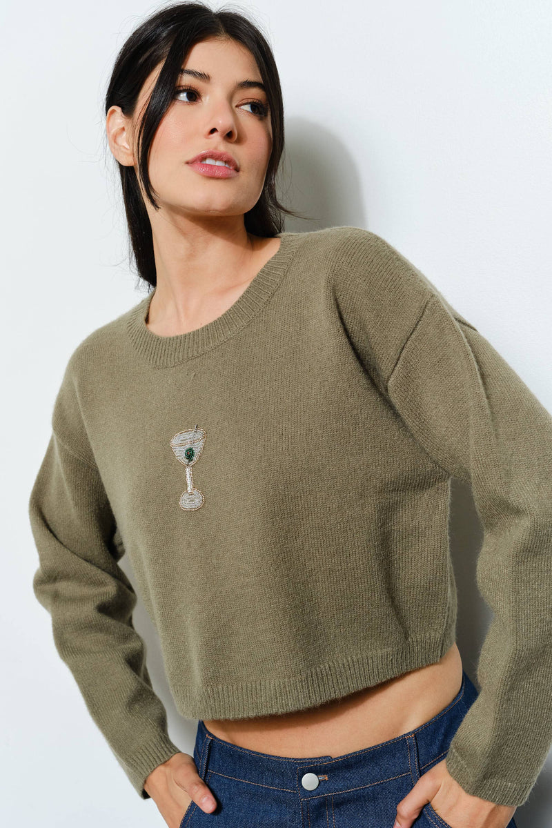 Cozy olive green cropped sweater featuring a playful martini bead design, perfect for everyday wear at a Long Island women’s boutique.