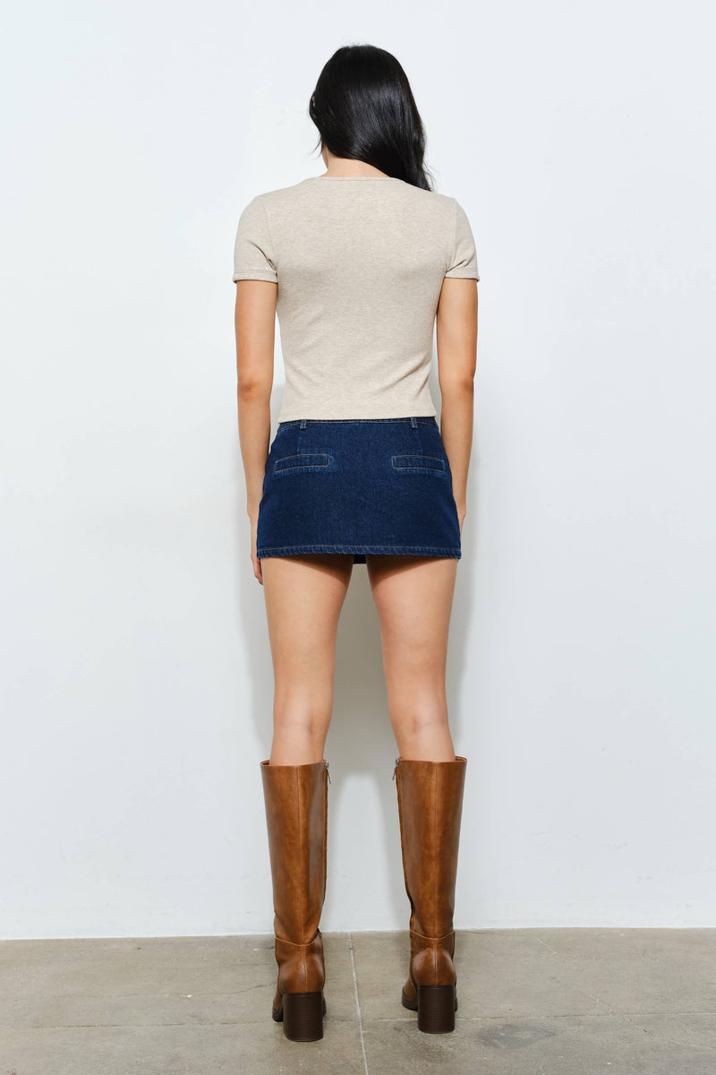 Ribbed beige button-up tee with short sleeves, perfect for layering in versatile Long Island boutique fashion.