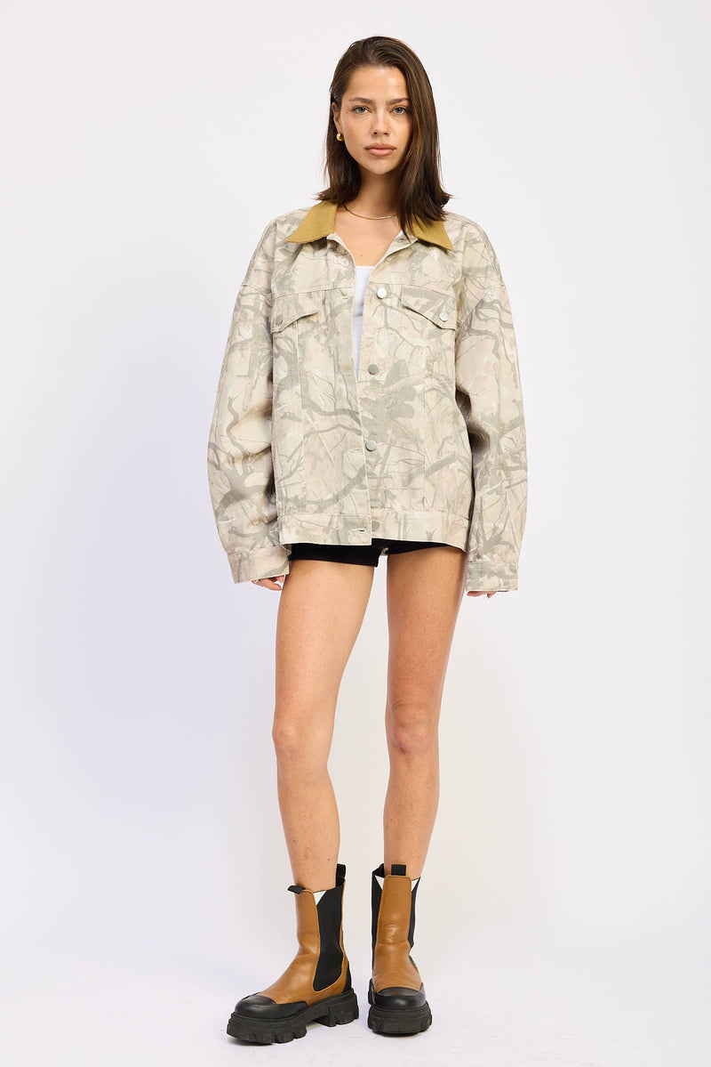 Oversized camo trucker jacket featuring a light gray and cream pattern with a contrasting mustard collar, perfect for Long Island boutique fashion.