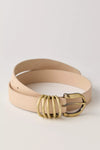 Stylish nude leather belt featuring a unique gold double-ring buckle, perfect for adding flair to any outfit in Long Island boutique fashion.