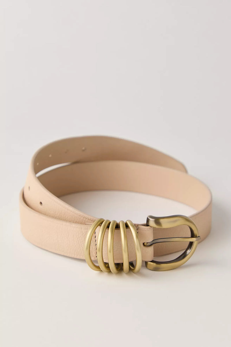 Stylish nude leather belt featuring a unique gold double-ring buckle, perfect for adding flair to any outfit in Long Island boutique fashion.