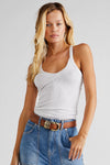Brown leather belt with a gold buckle, styled with a white ribbed tank top and denim shorts, perfect for Long Island boutique fashion.