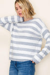 Soft crew neck sweater featuring bold white and gray stripes, perfect for layering in cozy Long Island boutique fashion.