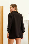 Sleek black 3/4 ruched sleeve blazer with structured fit, perfect for adding a touch of elegance to any outfit from this Long Island boutique fashion.