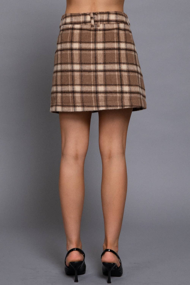 Brushed plaid mini skirt in warm browns and cream, featuring a fitted waist and a flared silhouette, perfect for Long Island boutique fashion.