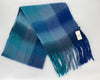 Blue plaid scarf with fringes on a white background