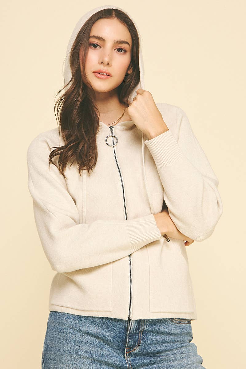 Woman wearing oatmeal zip-up hoodie cardigan front view