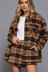 Front wrap plaid short pants in warm brown tones with a relaxed fit, perfect for chic Long Island boutique fashion styling.