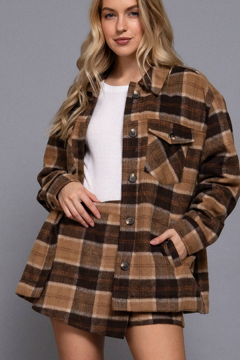 Front wrap plaid short pants in warm brown tones with a relaxed fit, perfect for chic Long Island boutique fashion styling.