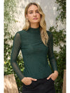 Embellished mock neck top in deep green, featuring sheer long sleeves and delicate rhinestone embellishments for a chic Long Island boutique fashion look.