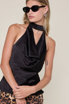 Sleek black cowl neck top with an open back, perfect for chic evenings out in Long Island boutique fashion.