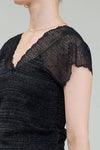 Black glitter woven sweater featuring a chic V-neckline and delicate lace cap sleeves, perfect for Long Island boutique fashion.