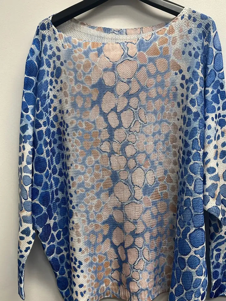 Lightweight round neck knit sweater featuring a blue and beige giraffe print, perfect for a stylish look from a Long Island boutique fashion.