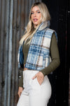 Cozy cropped puffer vest in a blue and cream plaid pattern, perfect for layering, ideal for Long Island boutique fashion.