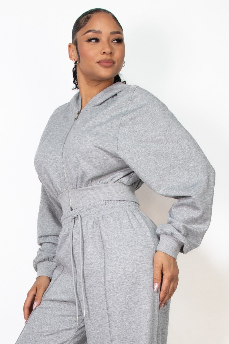 Cozy grey crop zip-up hoodie with a relaxed fit and hood, perfect for stylish layering in Long Island boutique fashion.