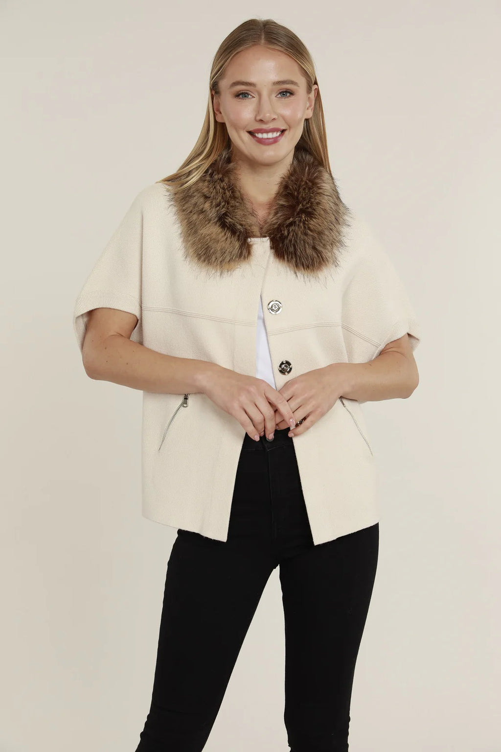Short sleeve black cardigan featuring a luxurious faux fur collar, perfect for stylish layering in Long Island boutique fashion.
