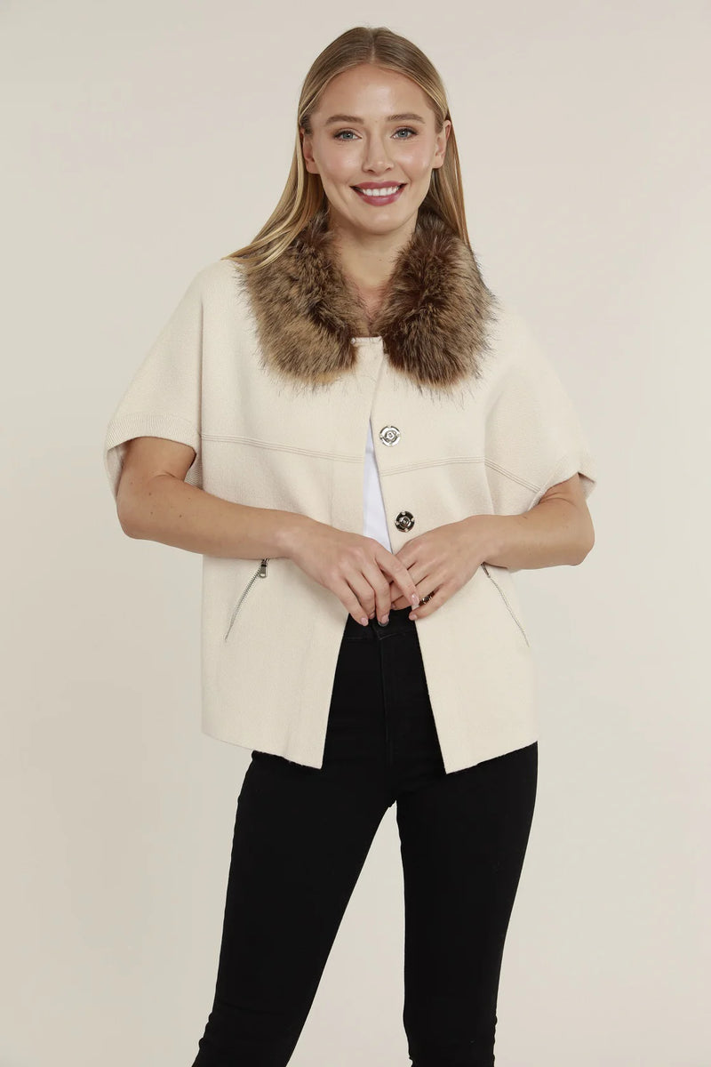 Short sleeve cream cardigan featuring a plush faux fur collar and stylish zippered pockets, perfect for Long Island boutique fashion.