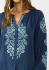 Navy embroidered raglan button blouse featuring floral patterns and a relaxed fit, ideal for Long Island boutique fashion.