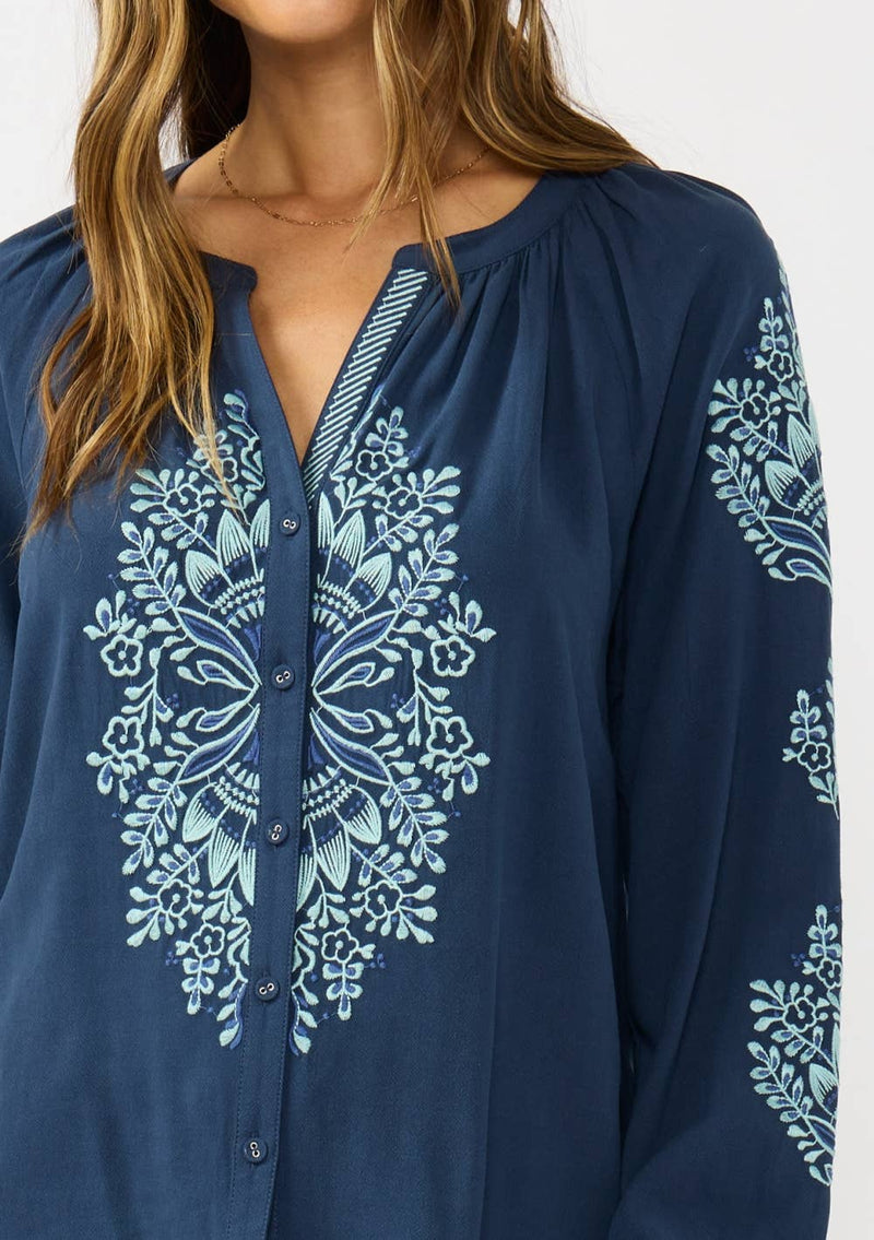 Navy embroidered raglan button blouse featuring floral patterns and a relaxed fit, ideal for Long Island boutique fashion.