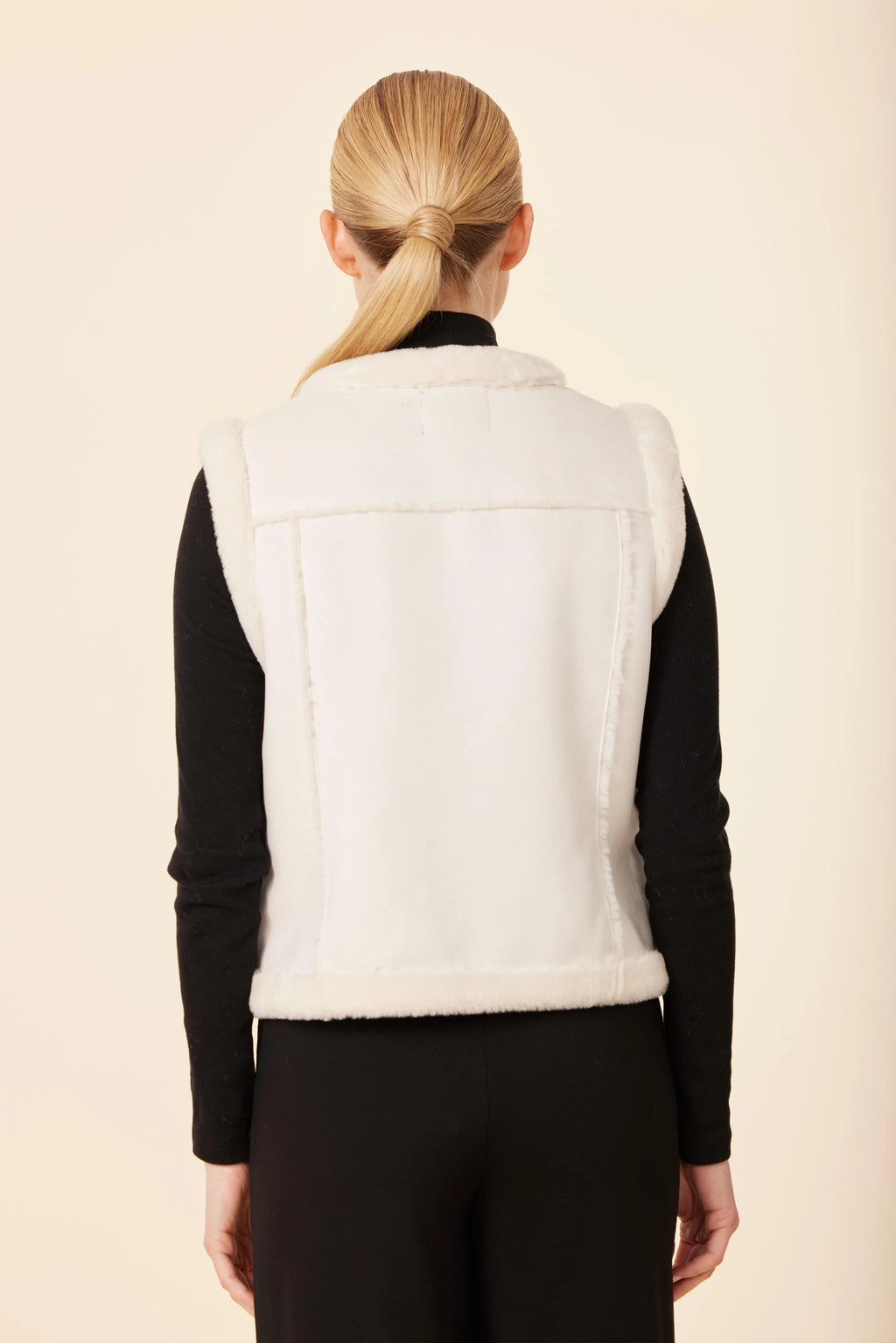 Chic white faux shearling vest with gold button details and front pockets, perfect for layering in Long Island boutique fashion.