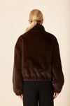 Cozy faux mink fur jacket in rich brown hue, featuring a relaxed fit and gathered hem, perfect for chic Long Island boutique fashion.