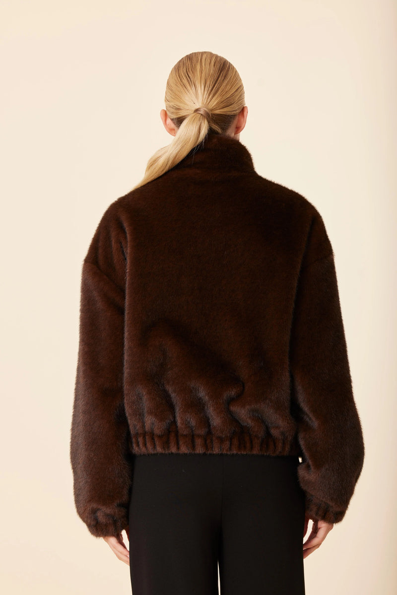 Cozy faux mink fur jacket in rich brown hue, featuring a relaxed fit and gathered hem, perfect for chic Long Island boutique fashion.
