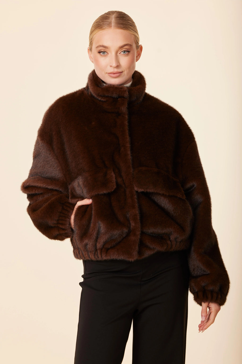 Soft, brown faux mink fur jacket with a high collar and oversized fit, perfect for stylish layering at a Long Island boutique fashion.