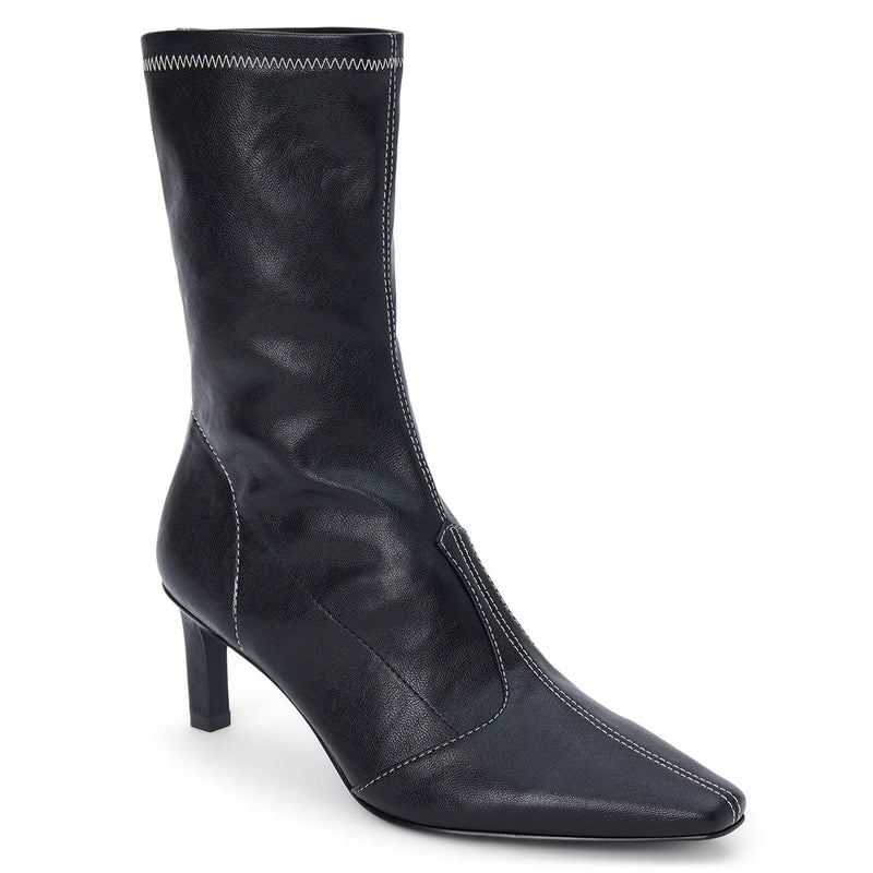 Chic black sock boot with pointed toe and subtle white stitching, perfect for adding style to any outfit from a Long Island fashion boutique.