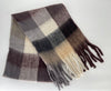Plaid scarf with fringes on a white background