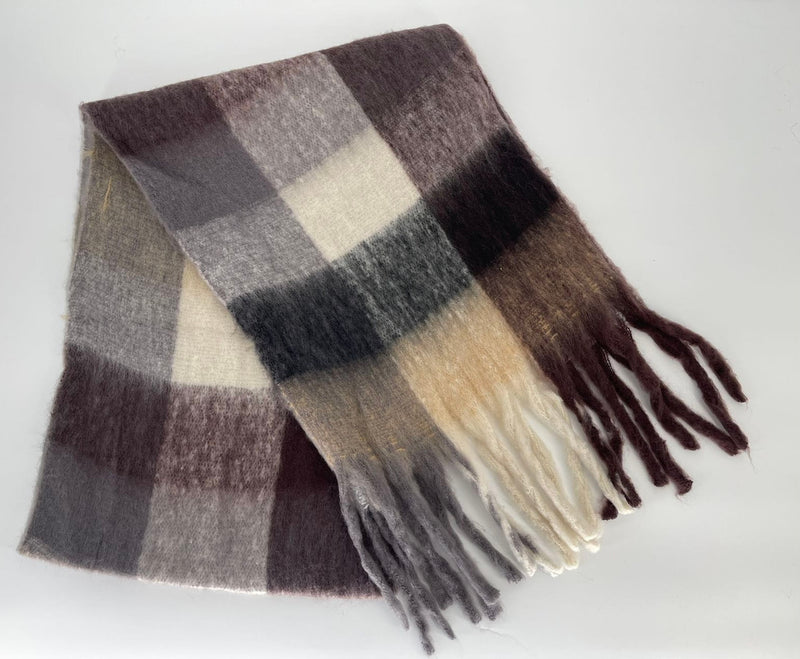 Plaid scarf with fringes on a white background