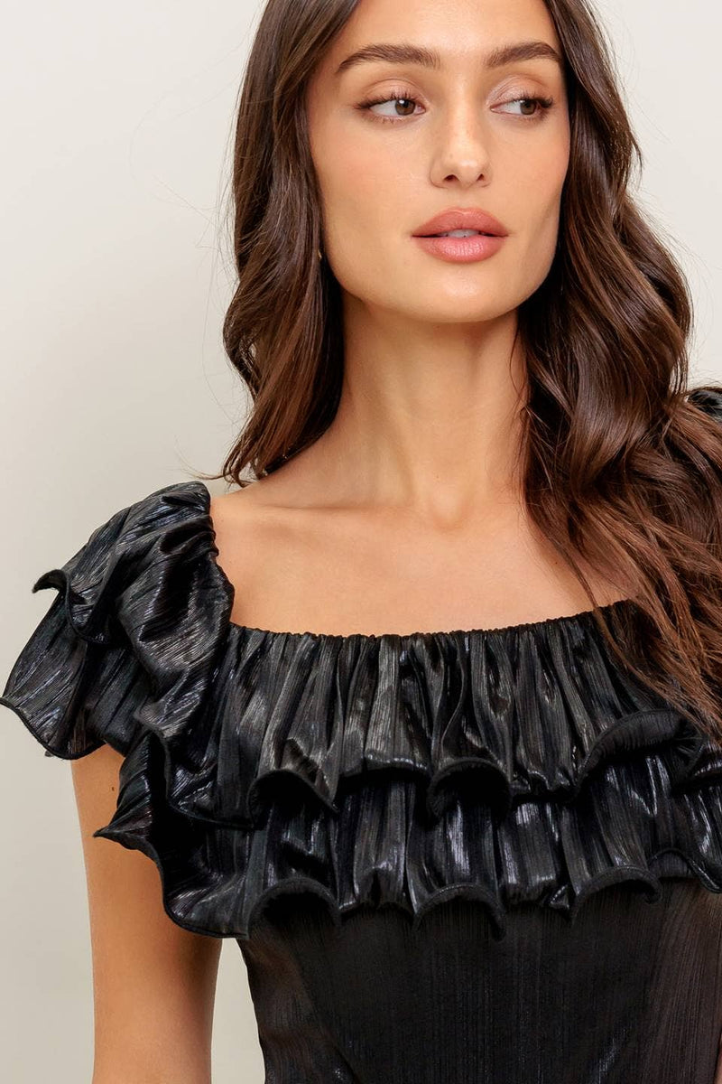 Black coated woven jumpsuit featuring a ruffled off-the-shoulder neckline, perfect for stylish evenings in Long Island boutique fashion.