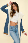 Denim sherpa hooded jacket featuring a plush, white fur lining with denim exterior, relaxed fit, and contrasting brown leather details, perfect for Long Island boutique fashion.