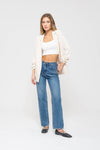 Chic 3/4 ruched sleeve blazer in soft cream, styled with a cropped top and high-waisted jeans for a trendy Long Island boutique fashion look.