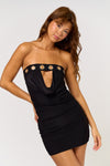 Striking black tube cowl mini dress featuring edgy metal eyelet accents, perfect for a night out in Long Island boutique fashion.
