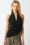 Chic black halter top featuring a draped silhouette and wrap design, perfect for elegant styling in any Long Island boutique fashion collection.