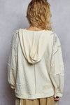 Model wearing V-Neck Patch Detail Stud Hoodie in Powder Cream with lace and stud accents — boho thermal top available at TandyWear Boutique in Commack, NY. back view