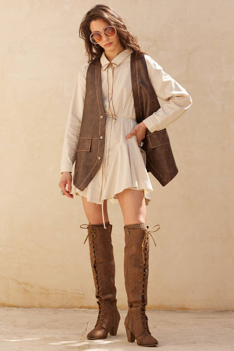 Stylish faux leather snap-front vest in rich brown, featuring a relaxed fit and front pockets, perfect for trendy Long Island boutique fashion.