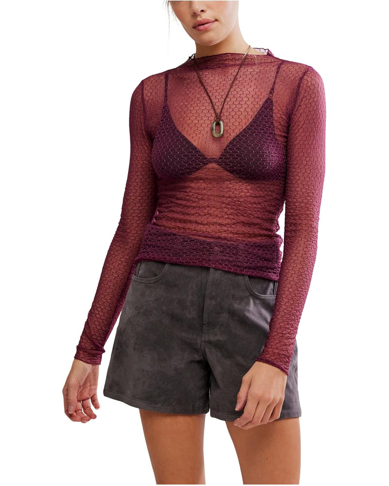 Sheer burgundy mesh long-sleeve top layered over a dark bralette, paired with stylish gray shorts, perfect for Long Island boutique fashion.