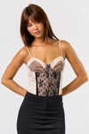 Sleek animal print mixed bustier bodysuit in soft pink with lace detailing, perfect for a chic Long Island boutique fashion look.